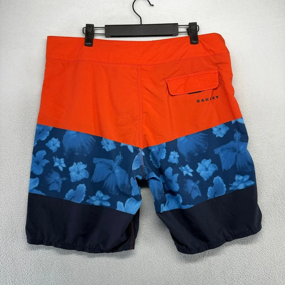 Oakley Board Shorts Men 33 Orange Blue Floral Performance Fit Swim Trunks Surf